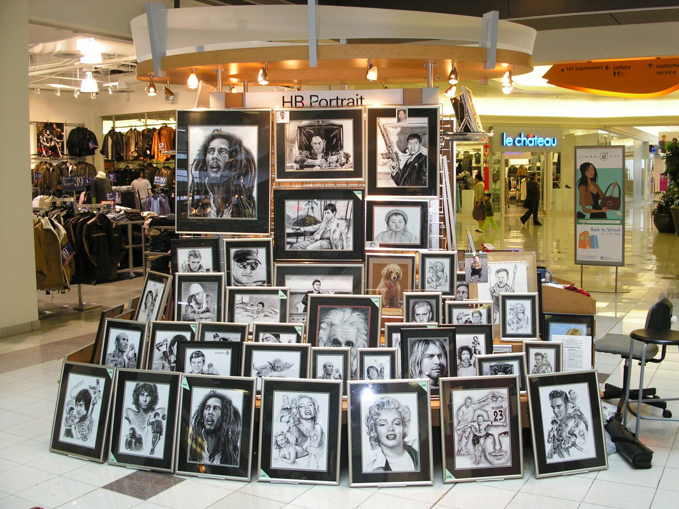 HB Portrait display of framed charcoal portraits at the mall